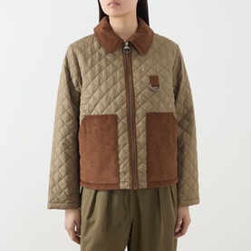 Model wearing Barbour Aylesby Quilted Jacket in Dusky Green with brown corduroy collar, patch pockets, and front zip fastening.