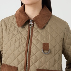 Model wearing Barbour Aylesby Quilted Jacket in Dusky Green with brown corduroy collar, front zip fastening and D-ring detail visible.