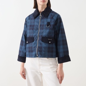 Model wearing Barbour Baiton Check Print Jacket in Weathered Marine, corduroy collar, D-ring detail, flap pockets, styled with white trousers