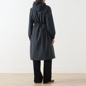 Model wearing Barbour Gracefield Showerproof Jacket in Dark Navy, rear view, hooded parka with elasticated waist, styled with black wide-leg trousers.