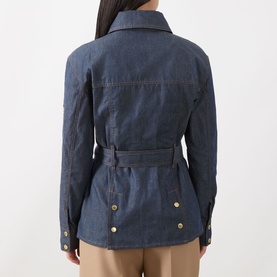 Model wearing Barbour International International Denim Trench Jacket in dark blue, rear view showing belt, gold-tone buttons and buttoned cuffs