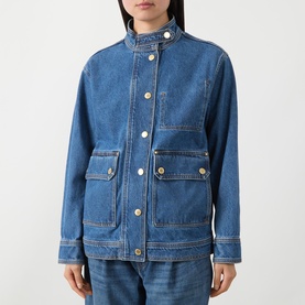 Model wearing Barbour International Nikki Biker Denim Jacket in Denim Blue with stand collar, oversized flap pockets and contrast stitching, styled
