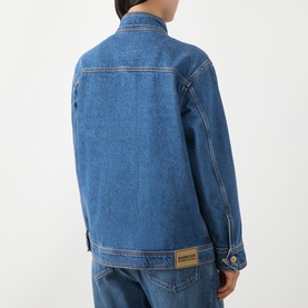 Model wearing Barbour International Nikki Biker Denim Jacket in Denim Blue, rear view showing logo badge, contrast stitching and dropped shoulders.