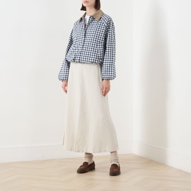 Model wearing Barbour Ovingham Gingham Print Jacket in Navy/Neutral with corduroy collar, styled with cream midi skirt and brown loafers.