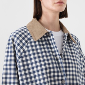 Model wearing Barbour Ovingham Gingham Print Jacket in Navy/Neutral with corduroy collar, styled with a white top.