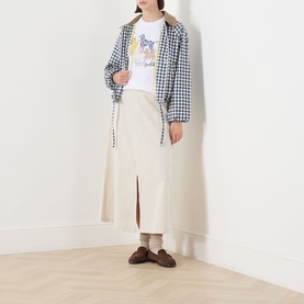 Model wearing Barbour Ovingham Gingham Print Jacket in Navy/Neutral with corduroy collar, styled with cream midi skirt and white graphic tee.