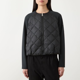 Model wearing Barbour International Seren Quilted Bomber Jacket in black, featuring diamond-quilted front, jersey sleeves and collarless zip-up