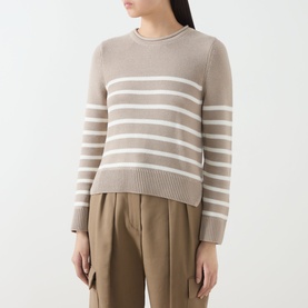 Model wearing Barbour Hinton Striped Knitted Sweater in Light Sand Stripe, cropped length with ribbed trims, styled with wide-leg trousers.