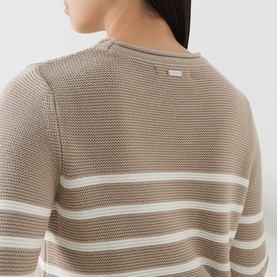 Model wearing Barbour Hinton Striped Knitted Sweater in Light Sand Stripe, showing textured stitch finish and white stripe detail at back.