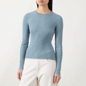 Model wearing Barbour International Seren Rib-Knit Sweater in Washed Pearl Blue, crew neck, long sleeves, ribbed cotton. Styled with white wide-leg
