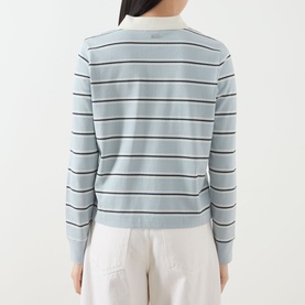 Model wearing Barbour Ashwell Logo Striped Polo Shirt in Celestial Blue Stripe, rear view showing ribbed cuffs and straight hem, styled with white