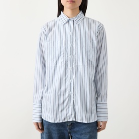 Model wearing Barbour Fawley Striped Shirt in Celestial Blue Folkstone Stripe, long sleeves with extended cuffs, styled with blue jeans