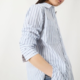 Model wearing Barbour Fawley Striped Shirt in Celestial Blue Folkstone Stripe, showing long sleeves with extended button cuffs and curved hem.