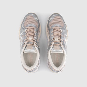 Overhead view of pink and silver mesh trainers with padded tongue, pale laces, and cream midsole