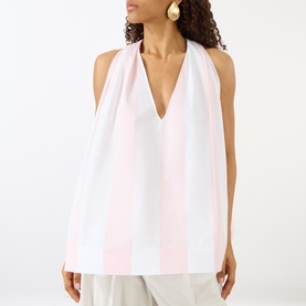 Model wearing Jacquemus shirt in Jacquard Big Stripes Light, sleeveless V-neck design with wide pale pink and white stripes, styled with wide-leg