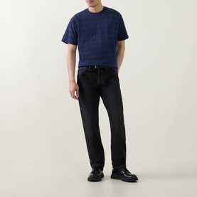 Model wearing Levis Grady Chevron Stripe Dress Blues Crew Neck T-Shirt with black jeans and black leather shoes.