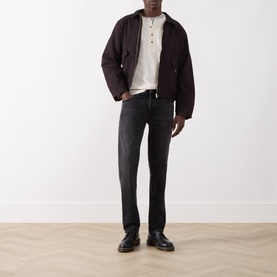 Model wearing Nudie Jeans B40 Dark Brown cotton casual jacket with grey T-shirt, dark washed jeans and black leather shoes.