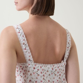 Model wearing Posse dress in Watercolour Floral print, back detail showing lace-trimmed straps and square neckline, 100% cotton