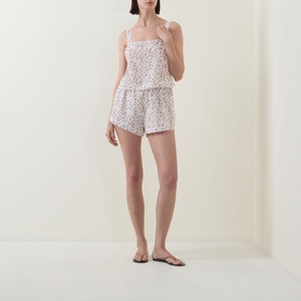 Model wearing Posse Watercolour Floral cotton cami top with matching floral shorts and flat sandals.