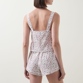 Model wearing Posse Watercolour Floral cotton camisole top, back view, styled with matching floral shorts