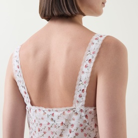 Model wearing Posse top in Watercolour Floral, back view showing lace straps and low open back with delicate floral cotton fabric.