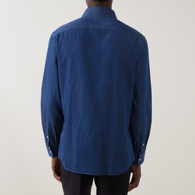 Model wearing B Cucinelli dark wash denim cotton casual shirt, rear view showing relaxed fit and button cuffs