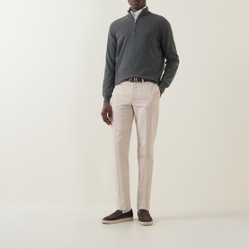 Model wearing Brunello Cucinelli Dark Green cashmere half-zip jumper, styled with stone chinos, white shirt, and navy loafers.