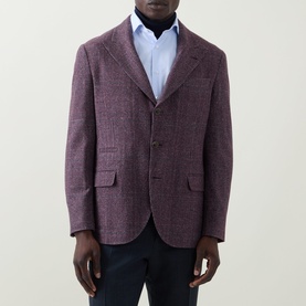 Model wearing B Cucinelli purple silk-wool-cashmere blazer jacket, styled with light blue shirt and navy trousers