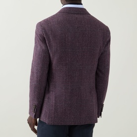 Model wearing B Cucinelli purple silk-wool-cashmere jacket, rear view, styled with blue shirt and dark trousers