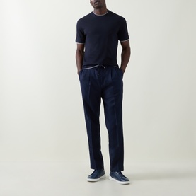 Model wearing B Cucinelli Contrast Trim Jersey T-Shirt in navy, styled with navy drawstring trousers and slip-on trainers.