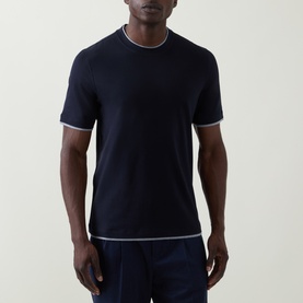 Model wearing B Cucinelli Contrast Trim Jersey T-Shirt in navy with grey contrast trims at neckline and cuffs, styled with navy trousers.