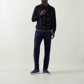 Model wearing B Cucinelli Contrast Trim Jersey T-Shirt in Navy, styled with a dark overshirt and navy tailored trousers.