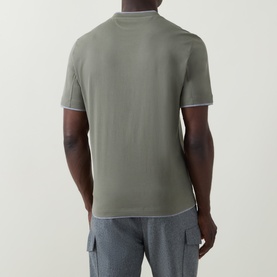 Model wearing B Cucinelli Contrast Trim Jersey T-Shirt in dark green with white contrast trim detail, rear view, styled with grey cargo trousers.