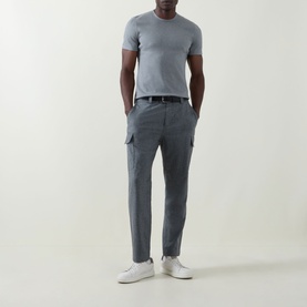Model wearing B Cucinelli Solid Regular Fit T-Shirt in mid grey with round neck, styled with grey cargo trousers and white trainers.