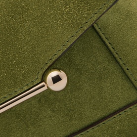 Strathberry Mosaic Nano Top Handle Bag in Lime/Khaki suede, close-up of gold-tone ball-stud Music Bar embellishment on flap closure