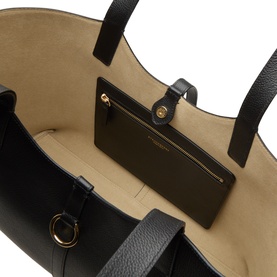 Strathberry Kite Leather Tote Bag in black grained leather, open top view showing beige interior with zip pouch and gold-tone hardware.