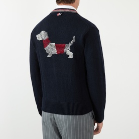 Model wearing Thom Browne navy wool-mohair cardigan, back view showing intarsia hound dog motif and striped collar detail.