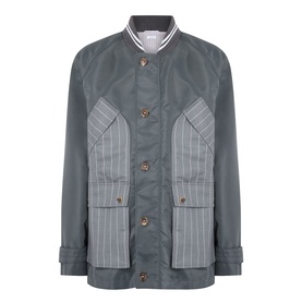 Thom Browne Tech Field Jacket in dark grey with contrast pinstripe panels, flap chest pockets, button fastening and ribbed collar
