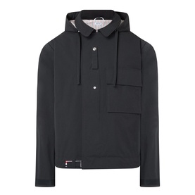 Thom Browne Mariner Technical Jacket in black with detachable hood, snap button fastening, chest pocket, and signature stripe loop tab.