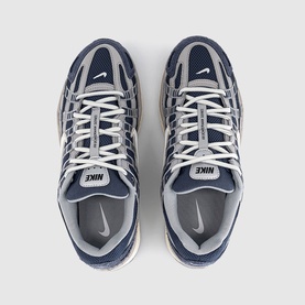 Nike P-6000 trainers in Thunder Blue and white, overhead flat lay showing mesh upper, chunky sole and branded tongue labels