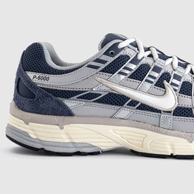 Nike P-6000 trainer in Thunder Blue and Sail, featuring mesh upper, white Swoosh, and chunky grey midsole