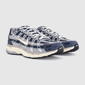 Nike P-6000 trainers in Thunder Blue and Sail, featuring silver mesh upper, navy suede overlays, and cream midsole