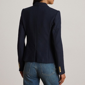 Model wearing Lauren navy blazer with gold buttons, shown from behind, styled with blue jeans