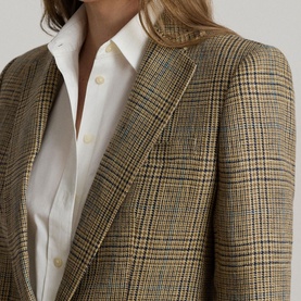 Model wearing Lauren blazer in Black/Tan Multi houndstooth check, styled with a white button-down shirt. Close-up detail shot.