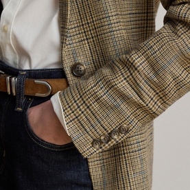 Model wearing Lauren Black/Tan Multi houndstooth blazer, styled with white shirt, dark jeans and tan leather belt with gold buckle.