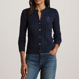 Model wearing Lauren navy cable-knit cardigan with gold buttons and RL monogram embroidery, styled with blue jeans