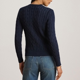 Model wearing Lauren navy cable-knit cardigan, back view, styled with light-wash jeans