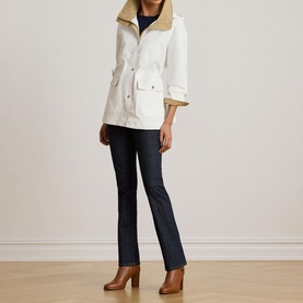Model wearing Lauren Mascarpone Cream coat with contrast collar, styled with dark jeans and tan heeled boots