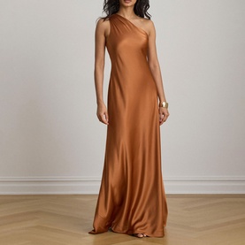 Model wearing Lauren Red Terracotta satin one-shoulder maxi dress with fitted silhouette, styled with gold bangle bracelet