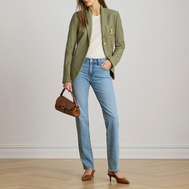 Model wearing Lauren Light Agave blazer with gold buttons, styled with white tee, light blue straight jeans, brown heels and small brown shoulder bag.
